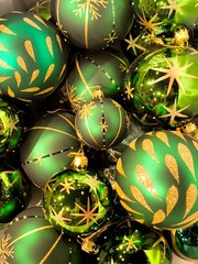 An abundance of green glass Christmas tree balls with golden decorations