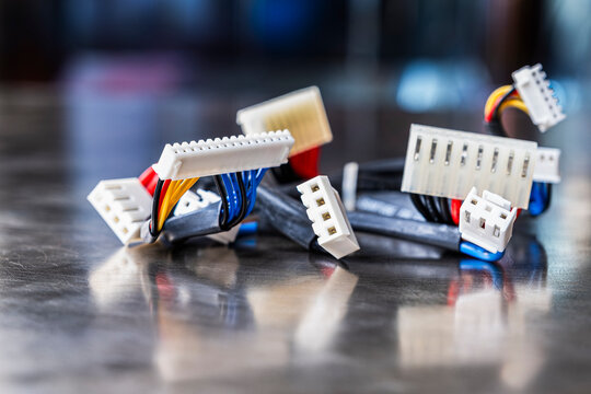 Electrical cable harnesses on the metal surface of the workshop