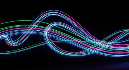 Colorful light streaks swirl and flow, forming an energetic abstract visual experience.