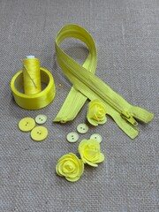 yellow sewing buttons  yellow zipper and sewing accessories