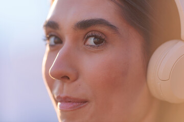 closeup of young woman wearing headphones