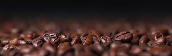 Roasted coffee beans macro with dark background