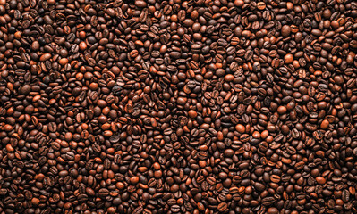 Roasted coffee beans texture background top view