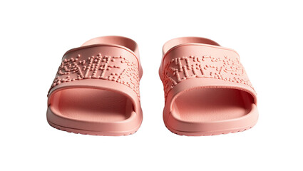 Pair of pink embossed slide sandals with textured strap detail on a stark for product display