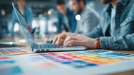Team collaborates in office setting to develop digital website design strategy during business meeting with diverse participants