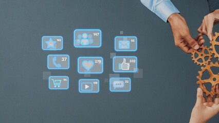 Two hands interact with glowing social media icons against a grey backdrop, symbolizing the importance of digital engagement and modern business communication strategies. Raster