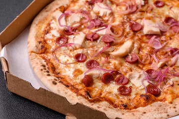 Italian pizza with sausage, chicken, and cheese for dinner. Sausage pizza