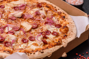 Italian pizza with sausage, chicken, and cheese for dinner. Sausage pizza