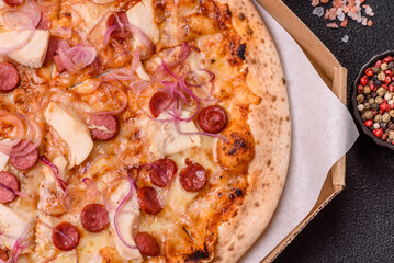 Italian pizza with sausage, chicken, and cheese for dinner. Sausage pizza