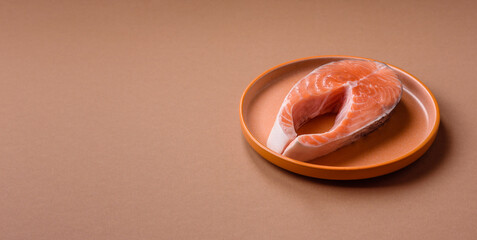 Fish, raw salmon steak, fresh seafood for grilling with salt, spices, and herbs. Raw salmon steak