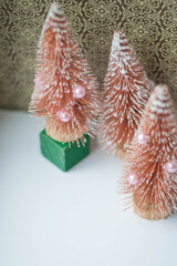 A toy Christmas tree in a vintage soft focus filter, vertical frame
