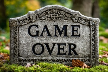 Game over tombstone engraving in a cemetery