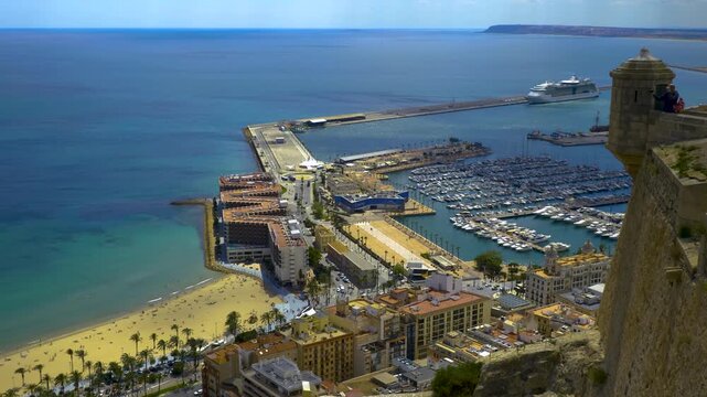 An Aerial panorama view of the city and harbour in Alicante in Spain on a cloudy spring day