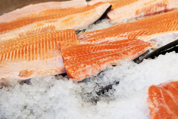 Fresh salmon fillets on ice for a delightful seafood feast