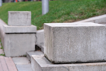 Concrete blocks create a modern pathway in a tranquil outdoor setting
