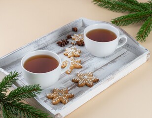 Plateau avec tasses de th&eacute; et biscuits traditionnels de No&euml;l. Generated Image. 