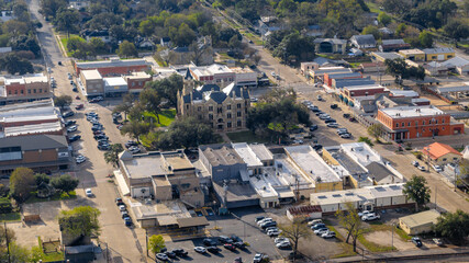 Fototapeta premium La Grange, Texas, USA - December 2, 2025 Aerial view of West Travis Street, La Grange on an overcast fall afternoon.