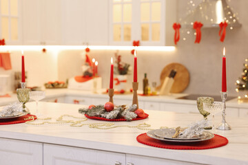 Christmas decor and tableware on countertop in kitchen. Interior design