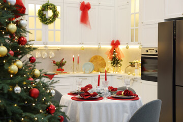 Festive table setting with Christmas decor in kitchen. Interior design