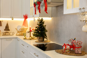 Beautiful Christmas decor and sweets on countertop in kitchen. Interior design