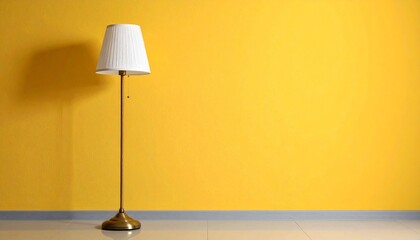 Yellow wall with brass floor lamp casting shadow on wooden floor