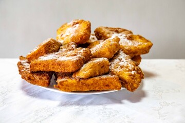 Golden Fried Christmas Dessert with Powdered Sugar, know as rabanadas de Natal