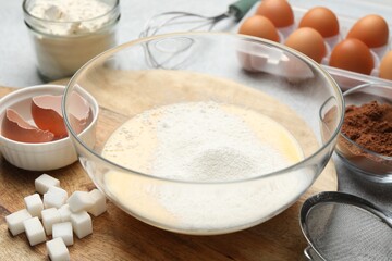 Different ingredients for dough on grey table, closeup