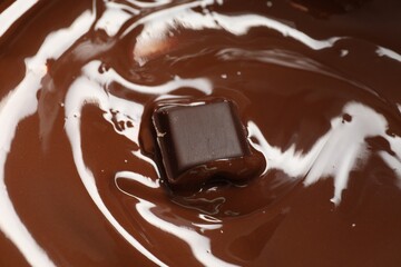 Tasty melted chocolate and piece as background, closeup