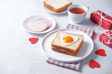 Heart shaped fried egg sandwich with ham and heart for Valentine's Day