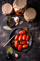 Marinated pickled tomatoes in jar