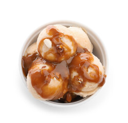 Tasty ice cream with caramel sauce and almonds in bowl isolated on white, top view
