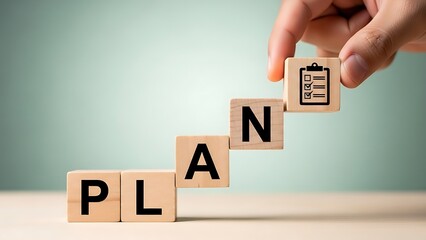 Business plan with wooden cubes building steps on light green background