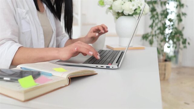 Woman engaged in digital content creation at home, Busy professional female crafting copy on computer in cozy studio, Caucasian woman focused on writing and editing in her welllit home office