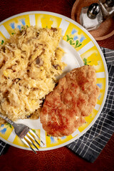 Minced meat cutlet with boiled sauerkraut.