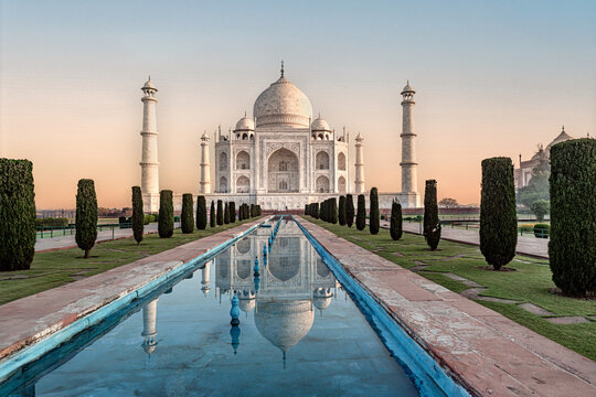 Taj Mahal sunrise view, famous mausoleum with reflection in Agra, Uttar Pradesh, India