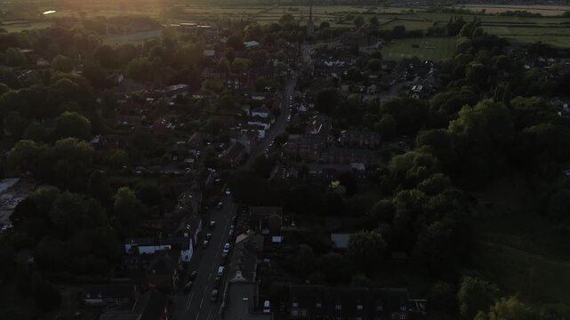 aerial view of Repton in Derbyshire, revealing the historic village layout, surrounding countryside, rooftops, roads, and green spaces within the rural English landscape
