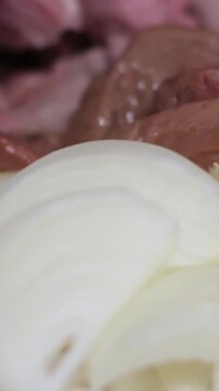 Slicing raw meat on a wooden cutting board in the kitchen. Raw beef meat, cooking process, stock video footage 4k.