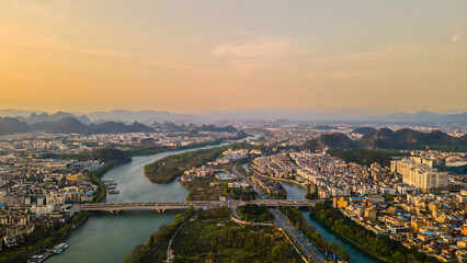 Fototapeta premium Guilin Golden Hour Aerial View - Karst Mountains and Rivers