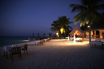 Luxury Beach Resort Dining at Twilight with Tropical Coastline