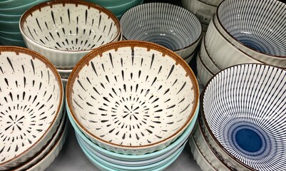 Different bowls on the shelf in the supermarket photo 