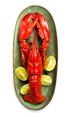 Lobster on plate isolated on white background, Lobster seafood, gourmet food, steamed lobster with big claws on a plate with lemon, top view, flat lay, from above. Vertical banner art design, closeup