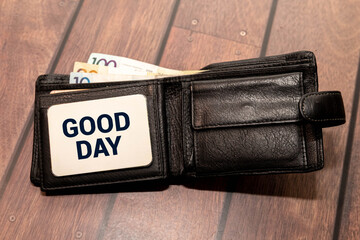 good day text with flowers decoration on wooden background