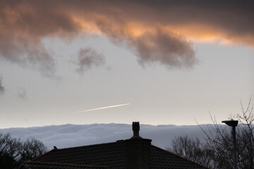 Dramatic Sunset above rooftops woth copy space