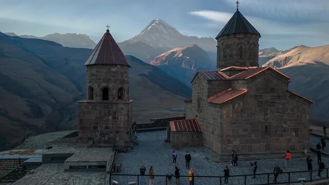 The Church of the Holy Trinity (Gergeti) with a view of Mount Kazbek, in the village of Stepantsminda, Georgia
