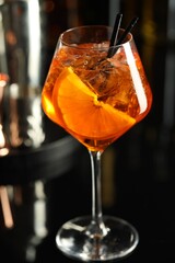 Refreshing spritzer cocktail on table in bar, closeup