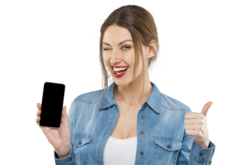 Cheerful woman winking and holding a smartphone with blank screen, giving thumbs up