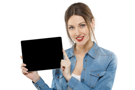 Attractive woman in denim shirt holding and pointing to a tablet with black screen - Powered by Adobe