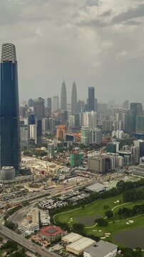 day time kuala lumpur city center mega construction traffic road aerial vertical panorama 4k timelapse malaysia