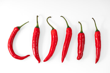 Top view of Collection of Large Red Chili Peppers Isolated on a White Background