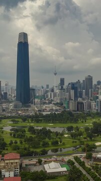 day time kuala lumpur city center golf course aerial vertical panorama 4k timelapse malaysia